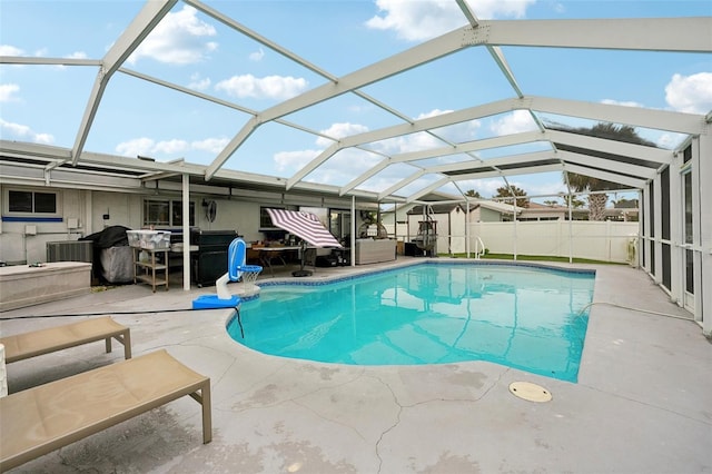 view of swimming pool with a patio, a lanai, central air condition unit, fence, and a fenced in pool