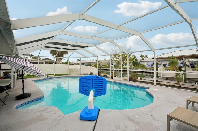 view of swimming pool with a fenced in pool, a lanai, a fenced backyard, and a patio