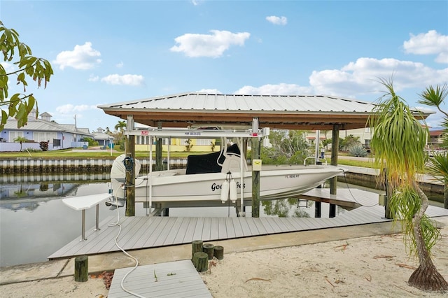 view of dock with a water view and boat lift