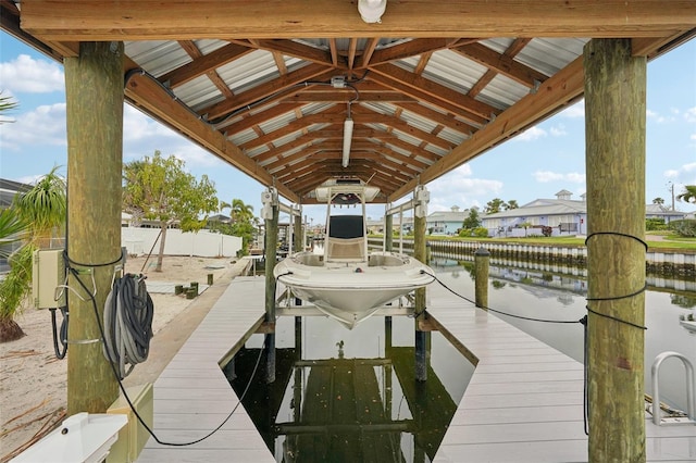 view of dock featuring a water view and boat lift