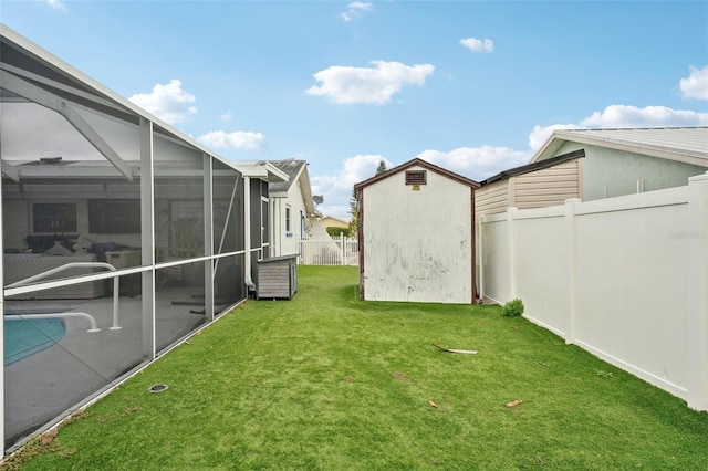 view of yard featuring a storage shed, glass enclosure, fence, cooling unit, and an outdoor structure