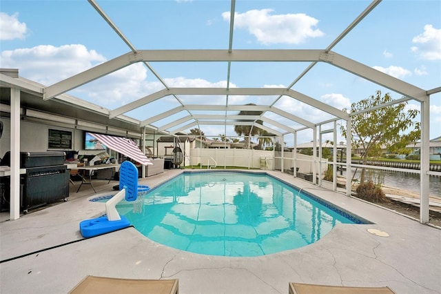 view of swimming pool with a fenced in pool, grilling area, glass enclosure, a patio area, and a fenced backyard