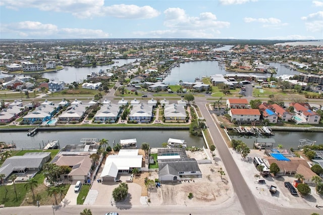 aerial view with a water view and a residential view