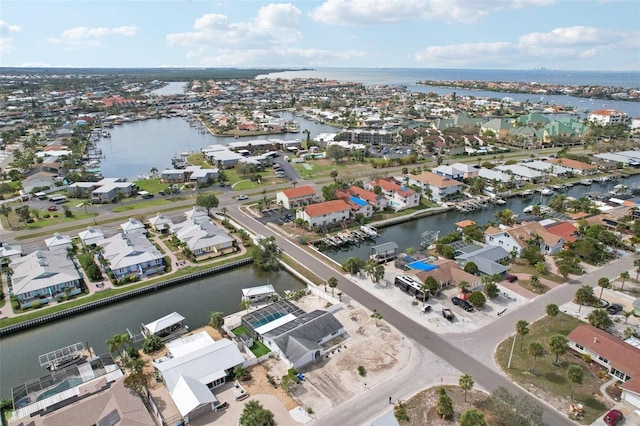 birds eye view of property with a residential view and a water view