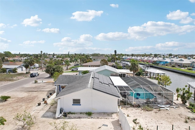 bird's eye view with a water view and a residential view