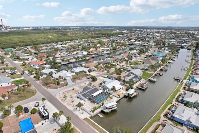 drone / aerial view featuring a water view and a residential view