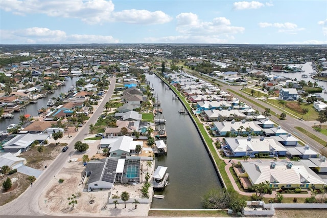 bird's eye view featuring a residential view and a water view