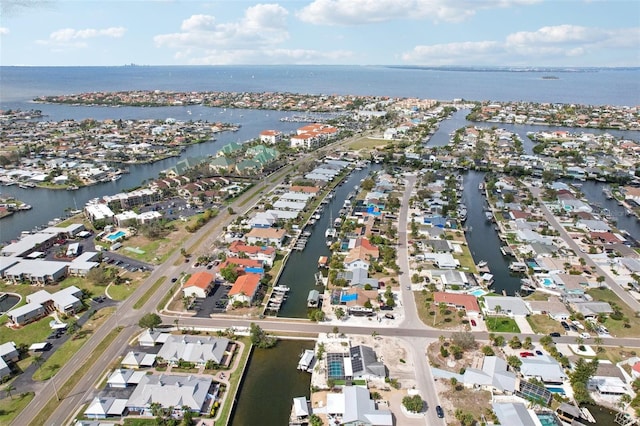 bird's eye view featuring a water view and a residential view