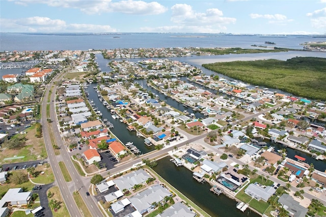 birds eye view of property featuring a residential view and a water view