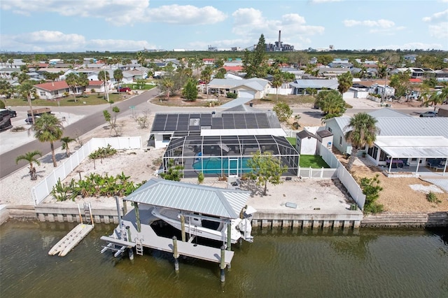 birds eye view of property with a water view and a residential view