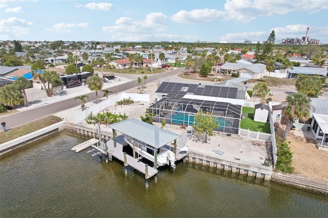 drone / aerial view with a residential view and a water view