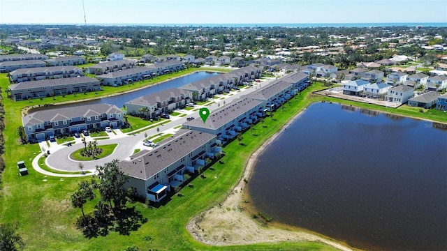 bird's eye view featuring a residential view and a water view