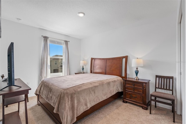 bedroom with light colored carpet