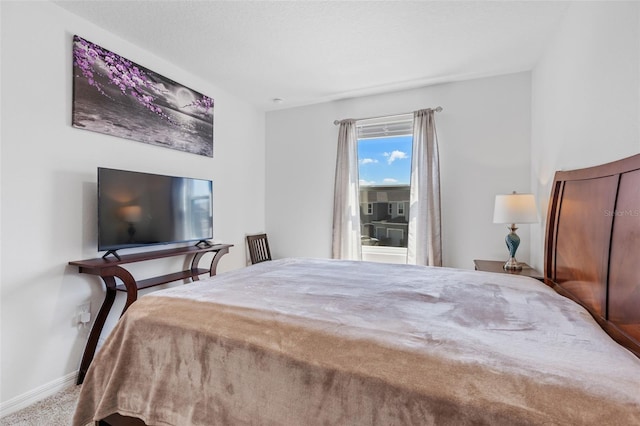 bedroom featuring baseboards