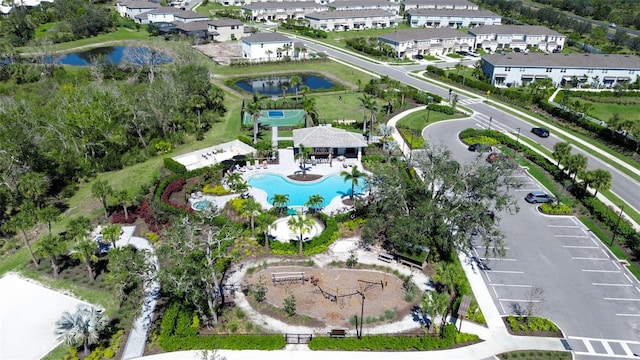 aerial view with a water view and a residential view