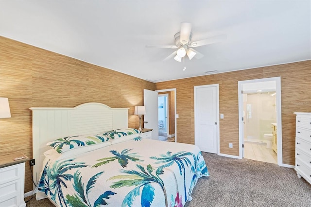 bedroom featuring carpet floors, ensuite bath, and ceiling fan