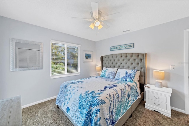 carpeted bedroom featuring ceiling fan, visible vents, and baseboards