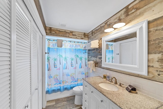 full bath with a closet, visible vents, and toilet