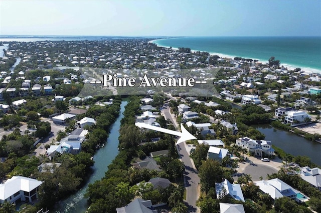 birds eye view of property with a water view and a residential view