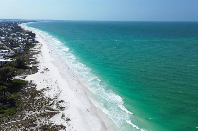 drone / aerial view with a view of the beach and a water view