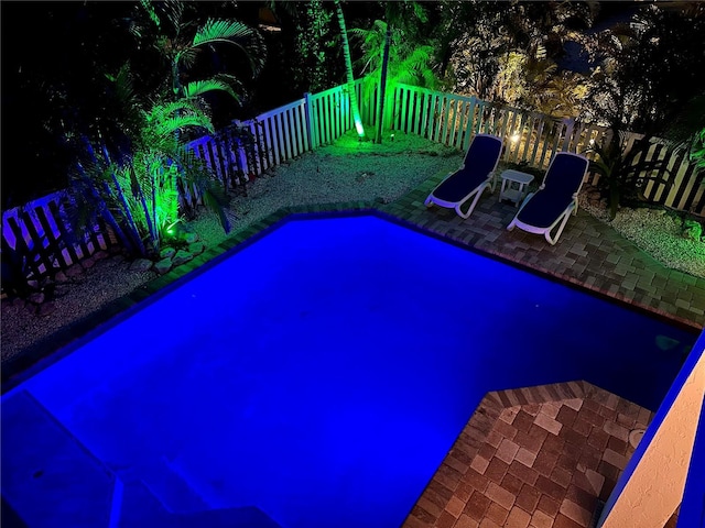 view of swimming pool with a patio area and a fenced backyard