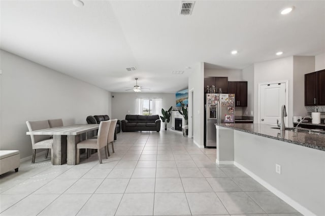 dining space with light tile patterned floors, baseboards, visible vents, a ceiling fan, and recessed lighting