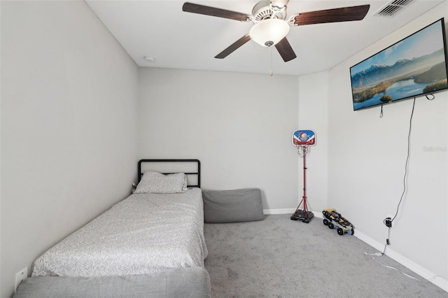 carpeted bedroom with ceiling fan, visible vents, and baseboards