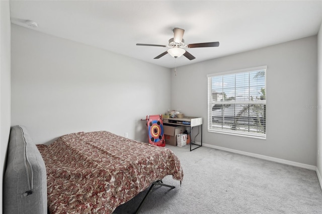 bedroom with carpet floors, baseboards, and a ceiling fan