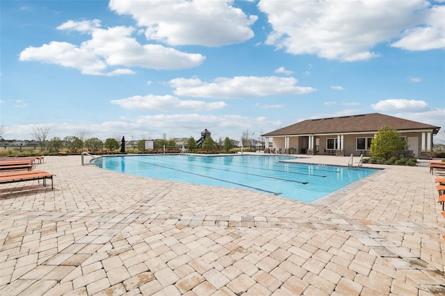 pool featuring a patio area and fence