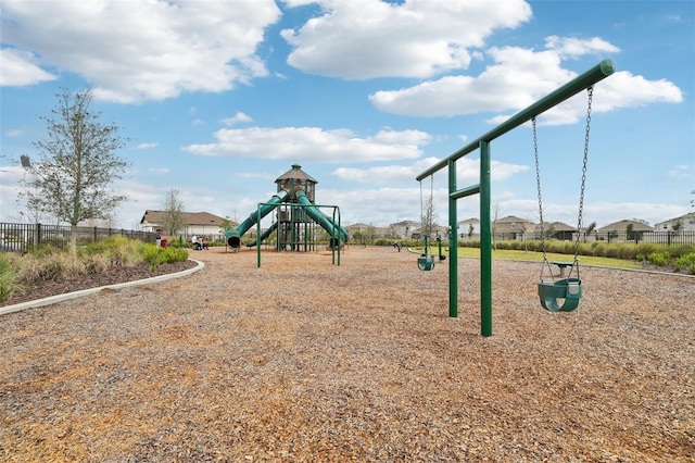 community jungle gym featuring fence