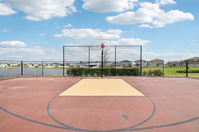 view of sport court featuring community basketball court and fence