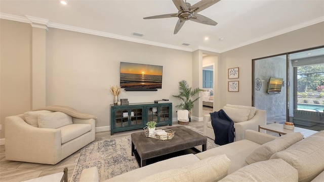 living area with visible vents, baseboards, and ornamental molding