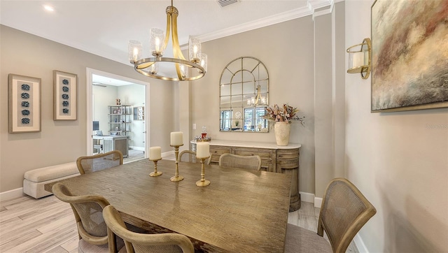 dining room featuring light wood-type flooring, baseboards, an inviting chandelier, and ornamental molding