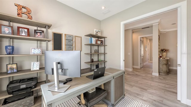 office with visible vents, light wood-type flooring, and baseboards