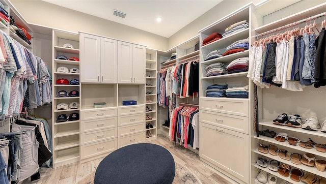 spacious closet with visible vents and light wood-style floors