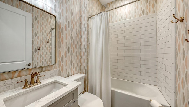 full bathroom with vanity, tile walls, toilet, and shower / bathtub combination with curtain