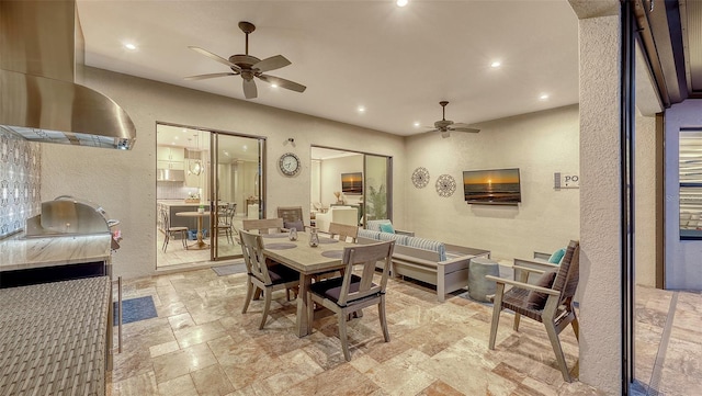 dining area featuring stone tile floors, recessed lighting, and ceiling fan