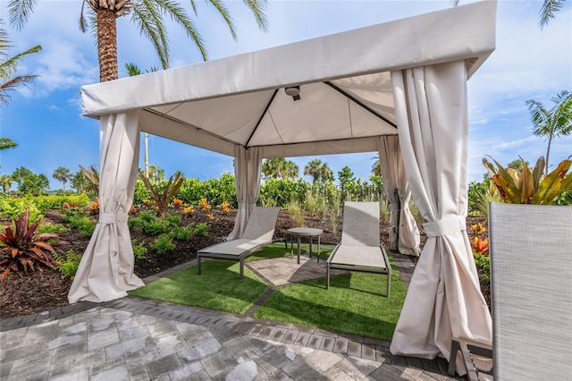 view of patio / terrace featuring a gazebo and fence