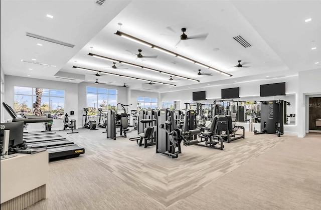 exercise room with visible vents and carpet floors