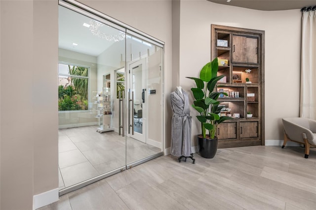 interior space featuring baseboards