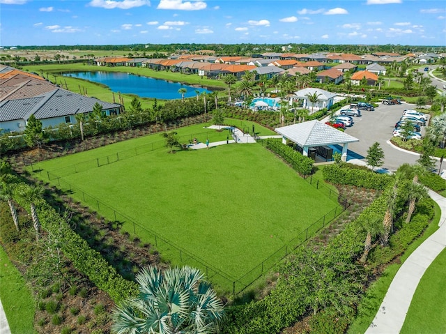 bird's eye view with a residential view and a water view