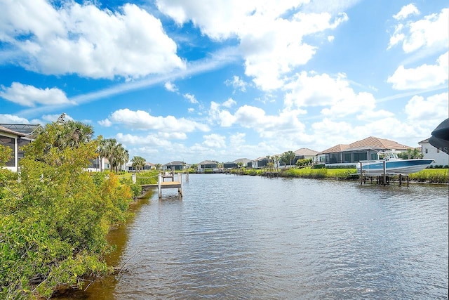 view of water feature featuring a boat dock and a residential view