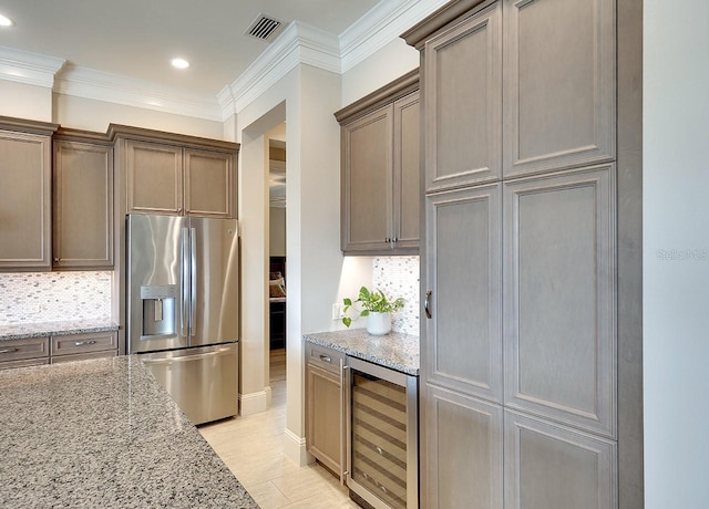 kitchen featuring wine cooler, stainless steel refrigerator with ice dispenser, backsplash, and crown molding