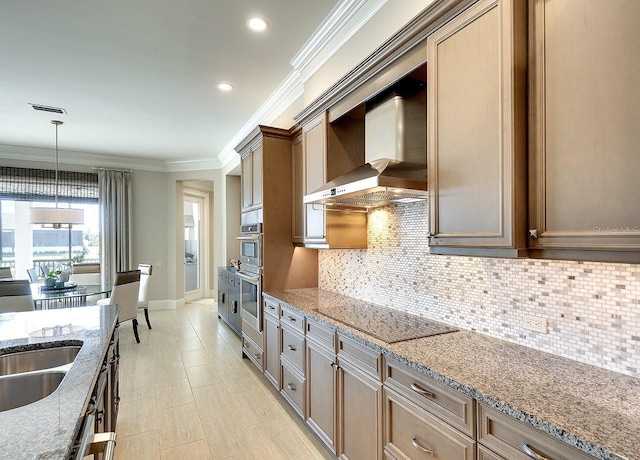 kitchen with decorative light fixtures, black electric cooktop, crown molding, wall chimney range hood, and backsplash