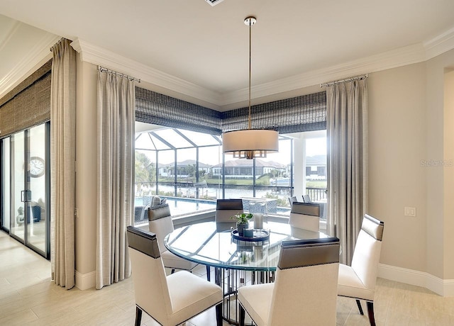 dining area with a sunroom, baseboards, and ornamental molding