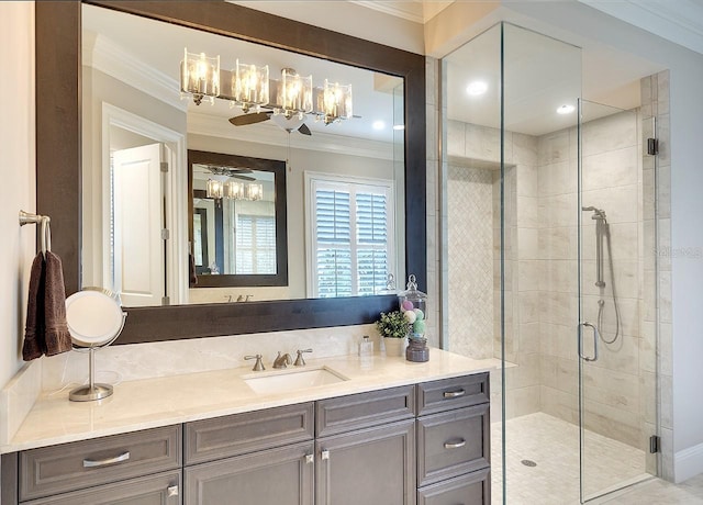 bathroom with a stall shower, vanity, and crown molding