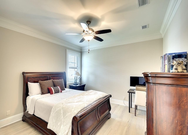 bedroom with visible vents, light wood-style flooring, and baseboards