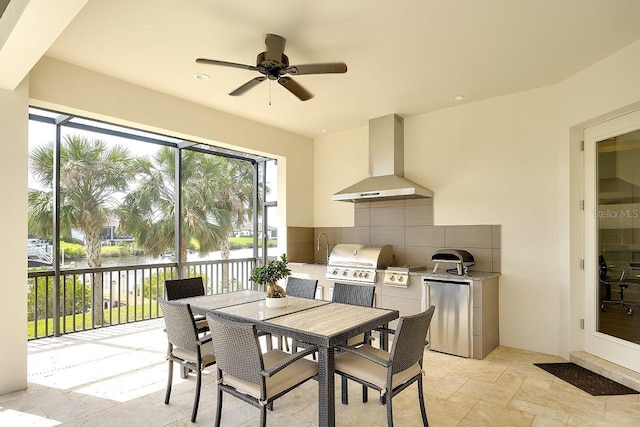 interior space featuring a water view, stone tile flooring, and a ceiling fan