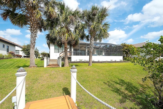 view of yard featuring glass enclosure