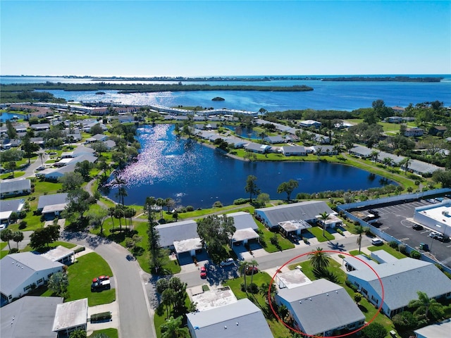 birds eye view of property featuring a residential view and a water view